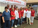 CPS Stadtmitte Das Team der CPS Stadtmitte/Hüls bei einem Gruppenfoto vor einem Pavillon auf dem Parkplatz der Pflegestation