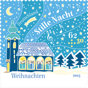 Banner mit der Weihnachtsmarke aus 2015 mit dem Motiv der alten, verschneiten St.-Nikolai-Kirche in Oberndorf bei Salzburg, in der die Kirchengemeinde gemeinsam das Lied „Stille Nacht“ singt