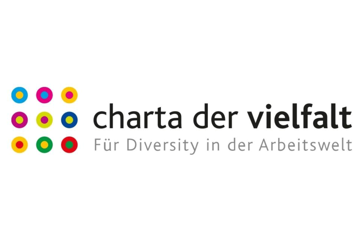 Logo der Charta der Vielfalt. Bunte Kreise und der Schirftzug. 