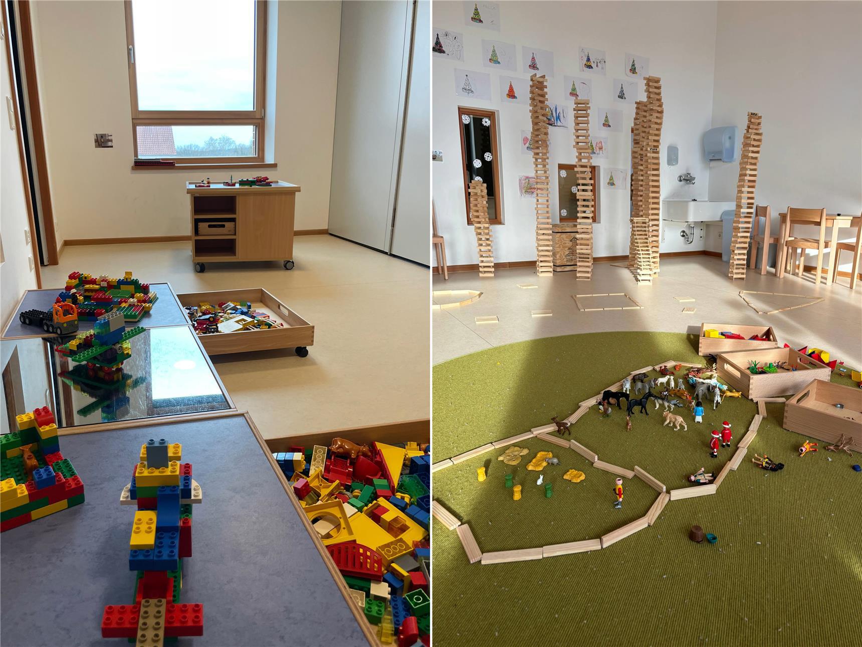 Ein heller Spielraum mit Bauklötzen, Legosteinen und Tierfiguren. Hohe Türme aus Holzklötzen und ein nachgebauter Bauernhof stehen im Mittelpunkt.