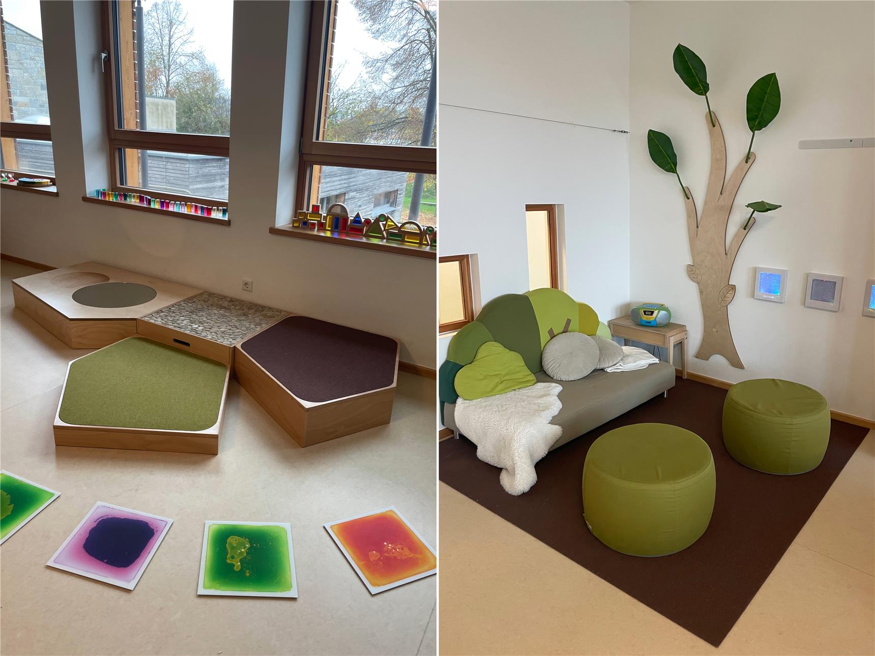 Ein gemütlicher Raum mit warmen Natur- Holzfarben. Braun, grün, weiß. Ein Wandbild von einem Baum. Ein Sofa. Kissen und Decken
