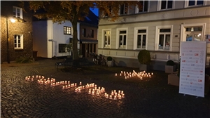 Caritas-Schriftzug aus Kerzen Caritas-Schriftzug aus Kerzen