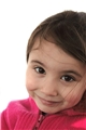 Ein lächelndes Mädchen im Grundschulalter / Fotolia